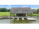 Charming boathouse on the lake with wooden beams and convenient boat storage at 280 Forest Bridge Rd, Franklinton, NC 27525