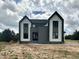 Striking new construction home with black framed windows and a modern color scheme at 280 Forest Bridge Rd, Franklinton, NC 27525