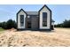 Striking two-story home featuring modern architectural design and a beautifully landscaped yard at 280 Forest Bridge Rd, Franklinton, NC 27525