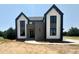 Modern two story home featuring a contrasting color palette and landscaped front yard at 280 Forest Bridge Rd, Franklinton, NC 27525