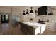 Modern kitchen with marble countertops, stainless steel appliances, and pendant lighting offers style and functionality at 280 Forest Bridge Rd, Franklinton, NC 27525