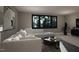 The living room has a large sofa, large windows, and art on the wall at 280 Forest Bridge Rd, Franklinton, NC 27525
