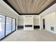 Open living room with built in cabinets, a fireplace and sliding glass doors at 280 Forest Bridge Rd, Franklinton, NC 27525