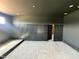 Living room with sleek black walls and recessed lighting, highlighted by modern wood slat accents at 280 Forest Bridge Rd, Franklinton, NC 27525