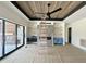 Spacious living room with stylish ceiling, fireplace, built-in cabinets, and sliding glass doors at 280 Forest Bridge Rd, Franklinton, NC 27525