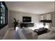This living room features a white sofa, large windows, and modern design at 280 Forest Bridge Rd, Franklinton, NC 27525