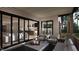 Open-concept space with living room and kitchen views from the covered porch, which features outdoor seating at 280 Forest Bridge Rd, Franklinton, NC 27525