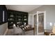 Bright home office boasts custom shelves, a stylish desk, and an open entryway at 280 Forest Bridge Rd, Franklinton, NC 27525