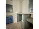 Corner office nook featuring gray cabinets and built in desk space at 280 Forest Bridge Rd, Franklinton, NC 27525