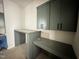 Home office space with stylish sage cabinets, desk, and matte black hardware at 280 Forest Bridge Rd, Franklinton, NC 27525