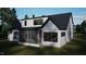 Rear exterior view of a stylish house with a screened porch at 280 Forest Bridge Rd, Franklinton, NC 27525