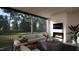 Inviting screened porch featuring a fireplace, comfortable seating, and a view of the outdoors at 280 Forest Bridge Rd, Franklinton, NC 27525