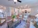 Open floorplan connecting kitchen and living room with bar seating, modern appliances, and lots of natural light at 121 Plainfield Ln # 134, Lillington, NC 27546