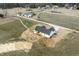 Aerial view of a single-Gathering home with a wooden deck in a rural area at 233 Surles Rd, Benson, NC 27504