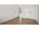 A bedroom featuring an exit to the deck, double door closet and modern flooring at 233 Surles Rd, Benson, NC 27504