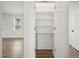 Bedroom closet with white shelving at 233 Surles Rd, Benson, NC 27504