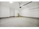Spacious garage with high ceilings, painted walls, and concrete floors at 233 Surles Rd, Benson, NC 27504
