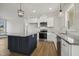Modern kitchen with stainless appliances, granite countertops, island, and lots of natural light at 233 Surles Rd, Benson, NC 27504