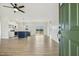 Open-concept living room flowing into the kitchen, with hardwood floors and natural light at 233 Surles Rd, Benson, NC 27504