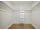 A walk-in closet featuring an open shelving unit and installed racks at 233 Surles Rd, Benson, NC 27504