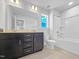 Bright bathroom with double sink vanity, tub and shower combo at 33 Macy Cir, Wendell, NC 27591