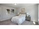 Bright bedroom with large windows and neutral decor at 33 Macy Cir, Wendell, NC 27591