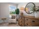 Bright bedroom featuring a chair, large window with a view, and stylish decor at 33 Macy Cir, Wendell, NC 27591