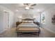 Bright bedroom with ensuite bathroom featuring a plush bed, bench, and neutral finishes at 33 Macy Cir, Wendell, NC 27591