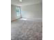 Spacious bedroom featuring plush carpeting and a sunlit window at 33 Macy Cir, Wendell, NC 27591
