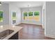 Dining room featuring wood floors, views from the windows and modern lighting at 33 Macy Cir, Wendell, NC 27591