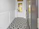 Welcoming entryway with decorative tile flooring and a glass-paneled front door that allows natural light at 33 Macy Cir, Wendell, NC 27591