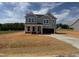 Charming two-story home with a paved driveway at 33 Macy Cir, Wendell, NC 27591