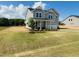 Charming two-story home with a well-manicured lawn, attached garage, and inviting front porch at 33 Macy Cir, Wendell, NC 27591