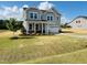 Inviting two-story home with a manicured lawn and a charming tree in the front yard at 33 Macy Cir, Wendell, NC 27591