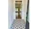 Elegant foyer featuring decorative tile flooring and views into the adjacent living spaces at 33 Macy Cir, Wendell, NC 27591