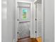 Bright hallway with a view into a bedroom and neutral paint at 33 Macy Cir, Wendell, NC 27591