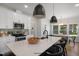 Well-lit kitchen featuring a large center island, stainless steel appliances, and modern pendant lighting at 33 Macy Cir, Wendell, NC 27591