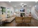Bright living room with fireplace, large windows, and comfortable seating at 33 Macy Cir, Wendell, NC 27591