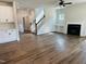 Open living space with fireplace, built-in shelves, staircase, and hardwood floors at 33 Macy Cir, Wendell, NC 27591