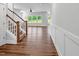 Spacious living room with hardwood floors, staircase, large windows overlooking the yard at 33 Macy Cir, Wendell, NC 27591