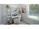 Cozy and well-organized office nook with shelves, a desk, stylish décor, and bright natural light at 33 Macy Cir, Wendell, NC 27591