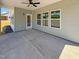 Covered patio featuring a ceiling fan, recessed lighting, and views of the backyard through windows at 33 Macy Cir, Wendell, NC 27591