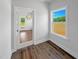Bright room with hardwood flooring, large window, and visible backyard through the doorway at 33 Macy Cir, Wendell, NC 27591