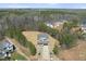 An aerial view of a two-story home featuring a spacious yard and surrounding trees at 40 Sunrise Ct, Spring Hope, NC 27882