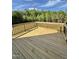 Newly constructed back deck with black metal railings overlooking private backyard at 40 Sunrise Ct, Spring Hope, NC 27882