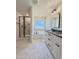 Bright bathroom featuring double vanity, garden tub, and separate shower with marble-look tiling at 40 Sunrise Ct, Spring Hope, NC 27882