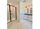 Bright bathroom featuring double vanity, garden tub, and separate shower with marble-look tiling at 40 Sunrise Ct, Spring Hope, NC 27882