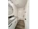 Bathroom featuring tub/shower combo, single vanity with gray counters, and wood-look flooring at 40 Sunrise Ct, Spring Hope, NC 27882