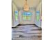 Bright dining area with hardwood floors and scenic wooded views through large windows at 40 Sunrise Ct, Spring Hope, NC 27882