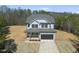An aerial view of a beautiful two-story home featuring a two-car garage and covered front porch at 40 Sunrise Ct, Spring Hope, NC 27882